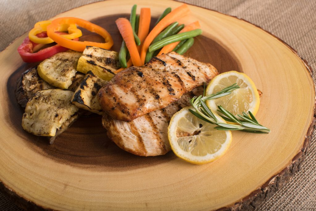 High Protein dish containing grilled chicken filet, and vegis.